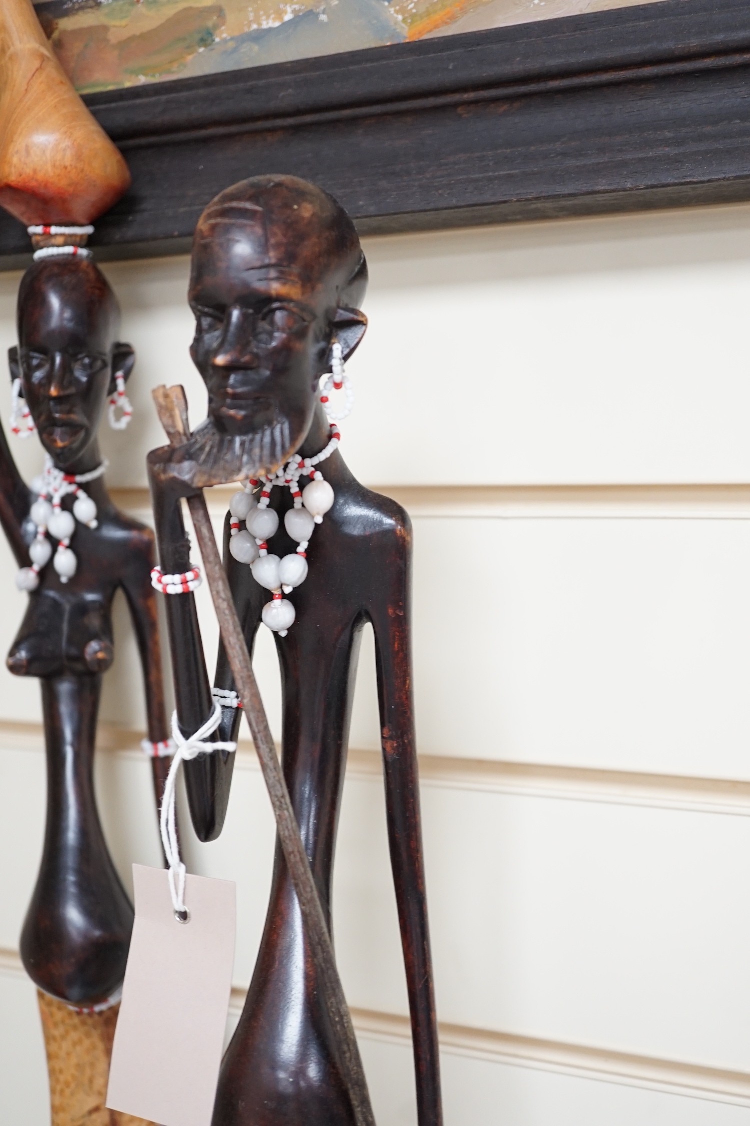 Two African carved wood figures, tallest 92cm